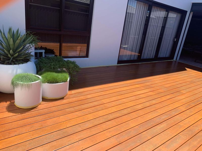 New wooden decking and potted plants