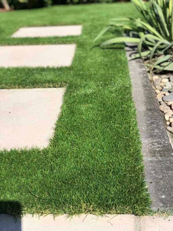 Newly turfed lawn with pavers